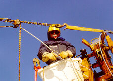 Bell Canada Lineman splicing an electric wire